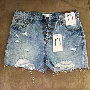 Pink lily High rise light distressed button up shorts- size medium. Never worn!